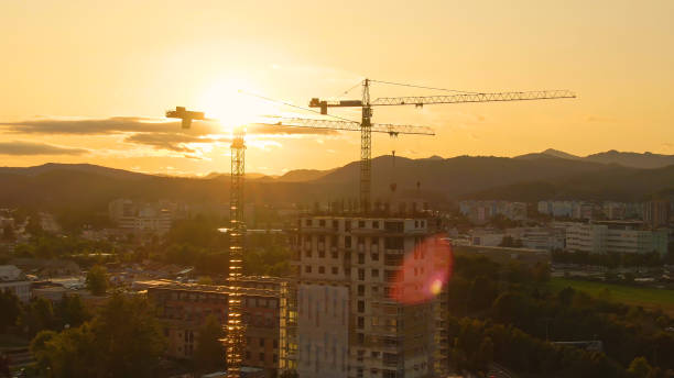 istock AERIAL: Warm morning sunbeams shine on a residential building under construction 1300966242