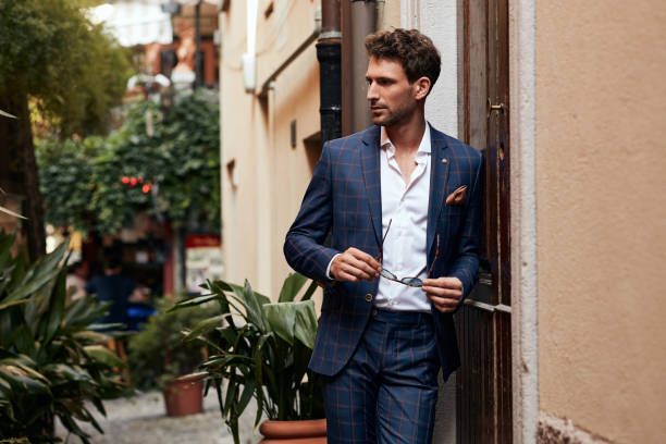 istock Young handsome man in classic suit 1300966297