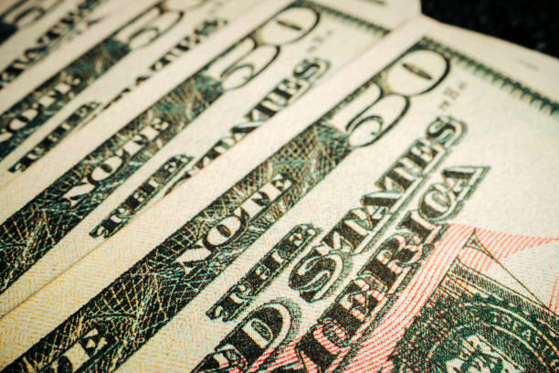 istock American dollar banknotes close up, macro photo 1300966477