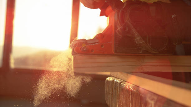 istock MACRO: Unrecognizable carpenter buffs the side of a plank with electric sander. 1300966506