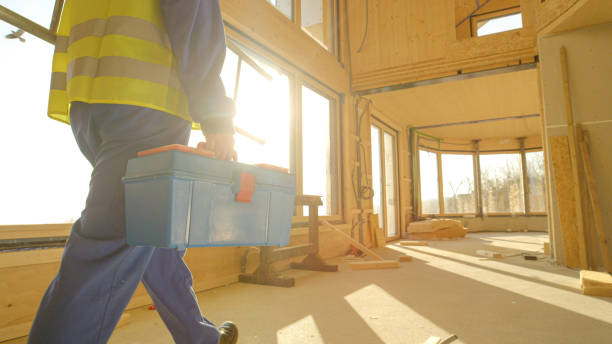 istock CLOSE UP: Unrecognizable builder arrives to work carrying his toolbox and ladder 1300966508
