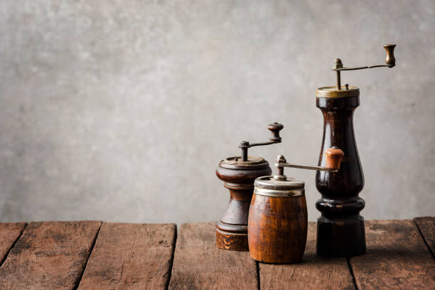 istock Various kinds of old pepper mills on wooden table 1300966512
