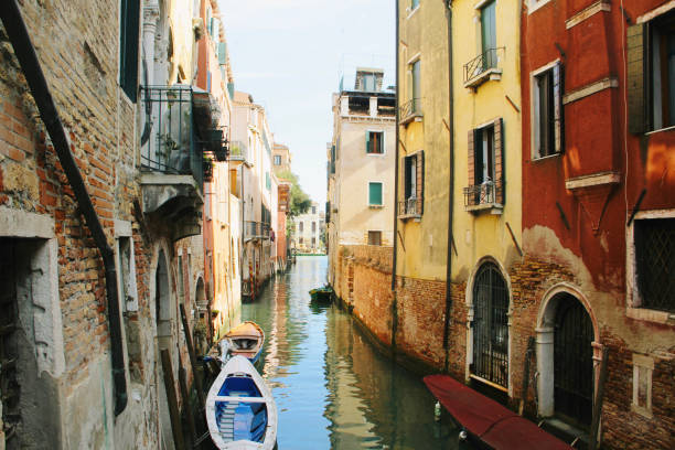istock Venice canal view with palaces and water 1300966637