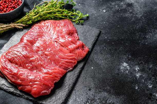 raw flank steak, marbled meat. black background. top view. copy space - beef sirloin steak raw loin imagens e fotografias de stock