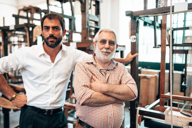 istock owner of a textile small business industry 1300967012