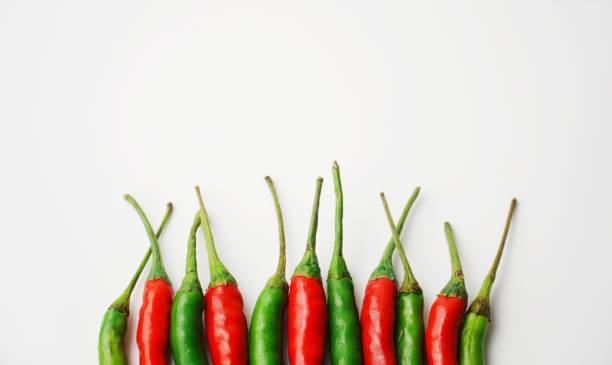 Red and green chili stalks