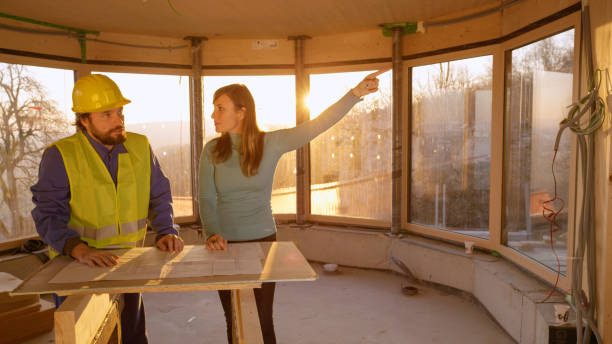 istock CLOSE UP: Young female entrepreneur argues with worker over construction plans. 1300970144