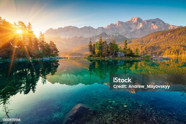 Impressive Summer Sunrise On Eibsee Lake With Zugspitze Mountain Range Sunny Outdoor Scene In German Alps Bavaria Germany Europe Beauty Of Nature Concept Background Stock Photo - Download Image Now