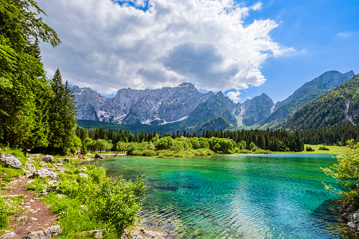 Fusine Lakes, two small lakes of glacial origin connected to each other by paths and located at the base of the Mangart mountain range