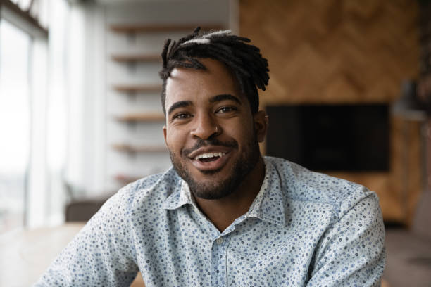 istock Friendly african male vlogger shooting clip content for personal channel 1300971885