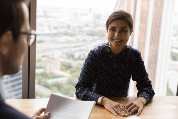 istock Confident young indian lady has job interview with male recruiter 1300972568