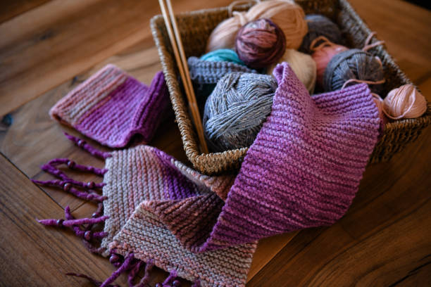 istock Accessories for knitting in basket ( yarn, needles) and scarf 1300972820