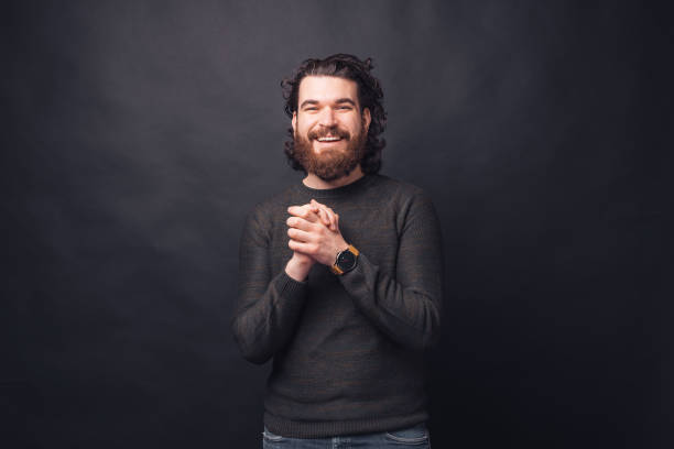 istock Portrait of charming young handsome bearded man looking at the camera 1300973571