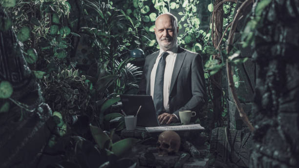 istock Confident businessman working in the jungle 1300974547