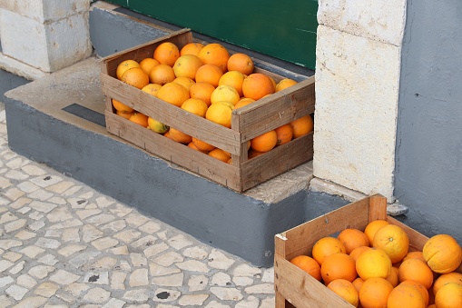 Box of fresh oranges in Algarve region, Portugal. Portuguese fruit.
