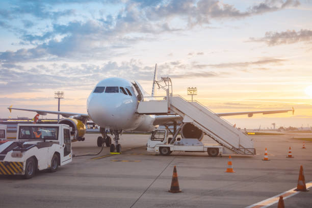 istock Empty Passenger Airplane in Airport at Sunset 1300974803