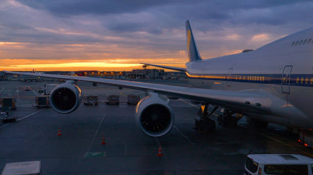 istock Massive airplane is being serviced before takeoff on a sunny winter evening 1300974842