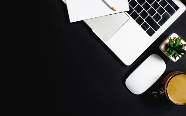 istock top view of laptop on black background 1300974877