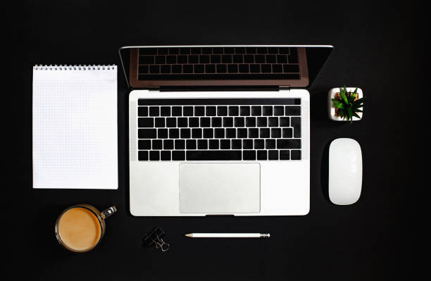istock top view of laptop on black background 1300974911