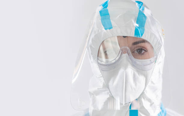 istock Female doctor in protective coronavirus suit 1300976485