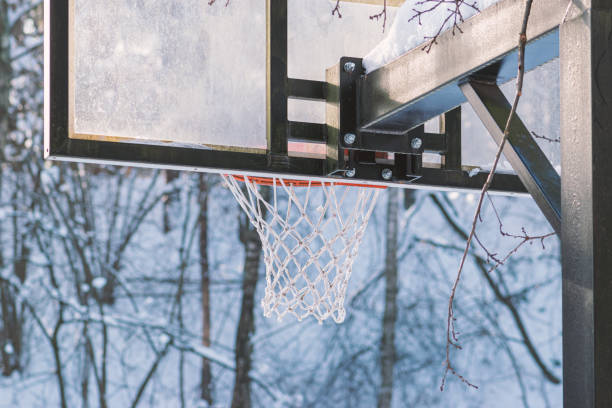 istock Basketball board covered with snow 1300976663