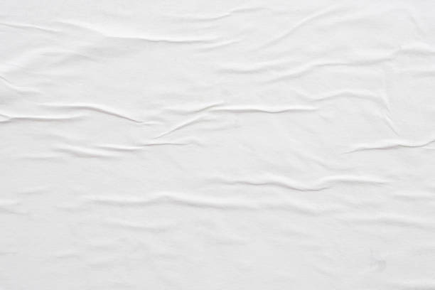 istock Blank white crumpled and creased paper poster texture background 1300980281