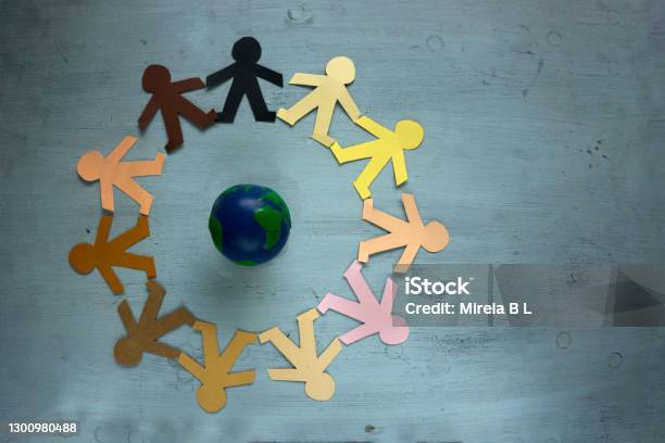 Humanity Races Protecting Our Planet Earth Together As A Society Stock Photo - Download Image Now