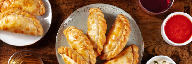 istock Empanadas panorama. Many empanadillas, shot from above 1300980897