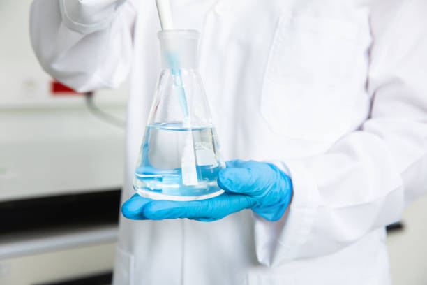 istock Scientist working in medical technology research laboratory with test tube. 1300982472