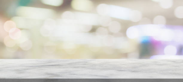 istock marble table top with blurred abstract cafe restaurant interior background 1300982788