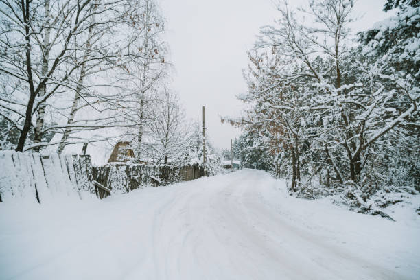 istock Snow-covered Russian village near the forest 1300982912