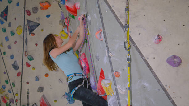 istock CLOSE UP: Experienced Caucasian teenager climbing a difficult indoor route 1300984787