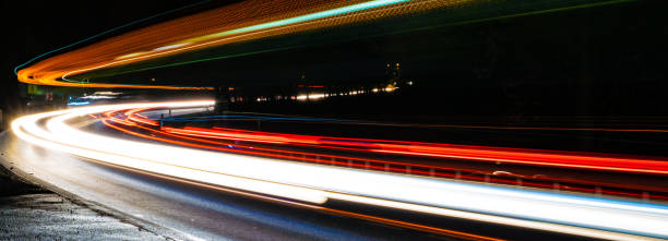 istock lights of cars with night 1300988191