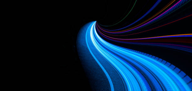 istock blue car lights at night. long exposure 1300988446