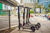 Electric scooters for rent. urban transport. Electric Ride Sharing Scooters Lined Up and Ready to Rent