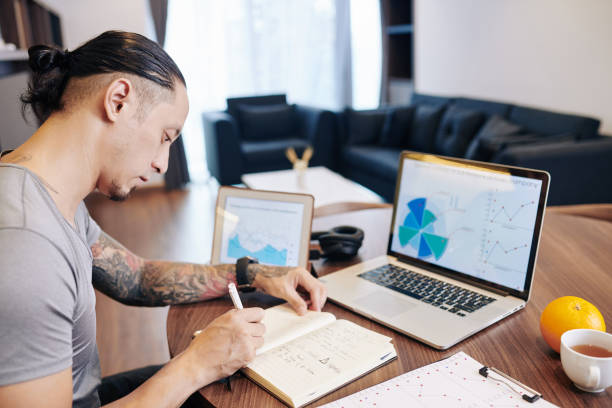 istock Businessman analzying statistics 1300991921