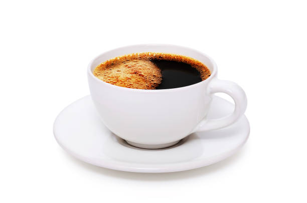 istock Black coffee in a white cup on plate top view isolated on white background 1300993380
