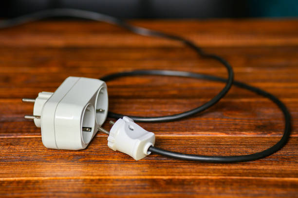 istock Cables and extension blocks, electreic devices in a mess 1300993622