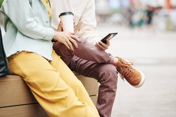 istock Couple sitting outdoors 1300993785