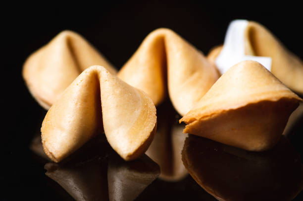 istock Chinese fortune cookies on dark background 1300993788