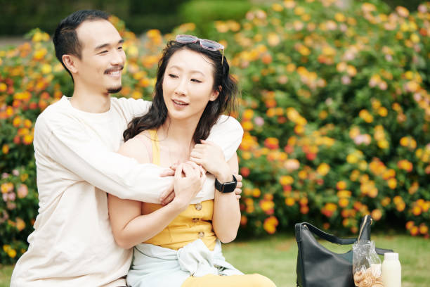 istock Chinese man hugging his girlfriend 1300993827