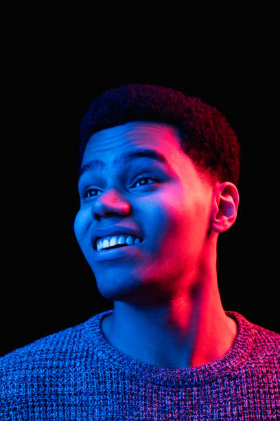 istock African-american man's portrait isolated on black studio background in multicolored neon light 1300994270