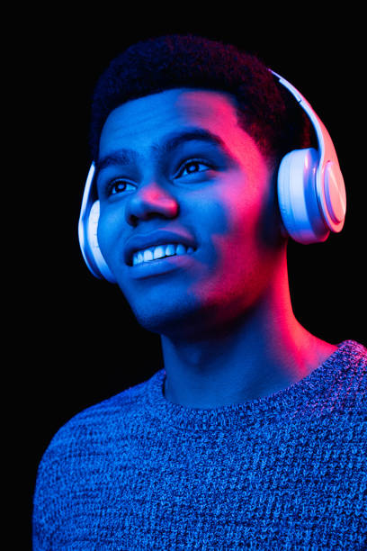 istock African-american man's portrait isolated on black studio background in multicolored neon light 1300994284
