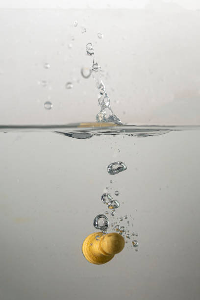 istock Chess pieces fall into the water with splashes 1300995998