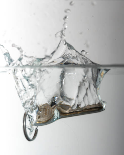 istock Key falls into the water with splash 1300996041