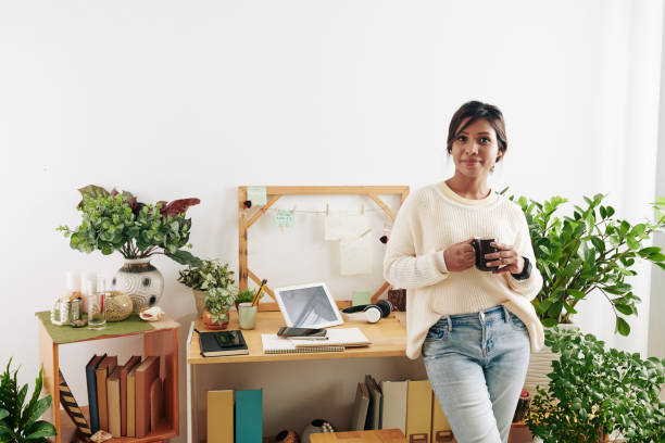 istock Creative woman at home office 1300996079