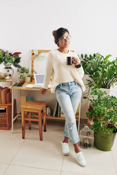 istock Graphic designer with cup of coffee 1300996112