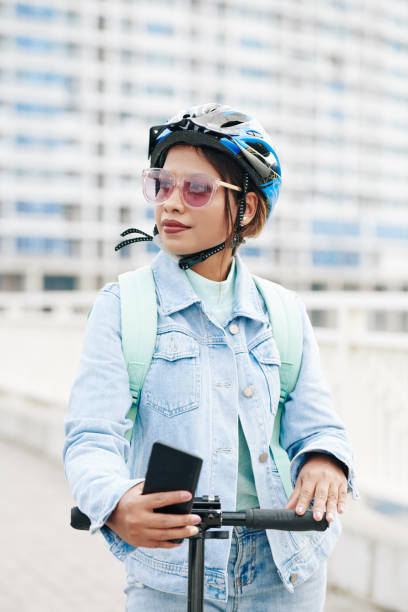 istock Woman riding in city 1300996144