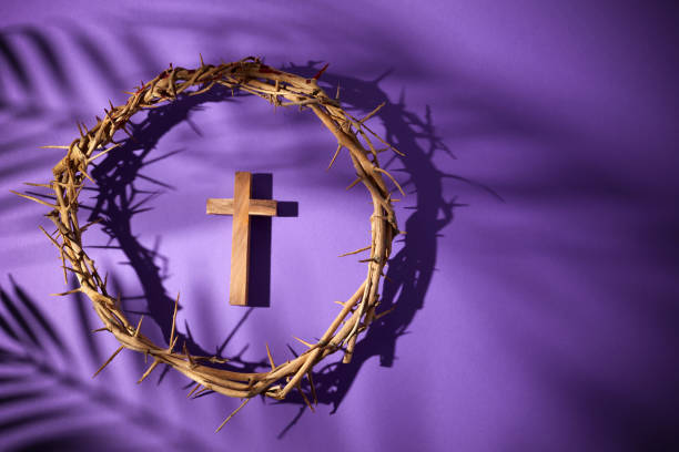 Lent season, Holy week and Good friday concept. Crown of thorns and cross on purple background Lent season, Holy week and Good friday concept. Crown of thorns and cross on purple background. lent stock pictures, royalty-free photos & images