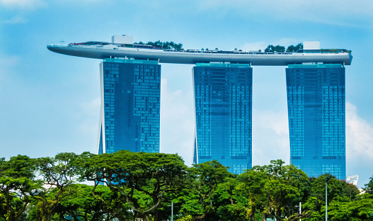 A view of the Marina Bay Sands building in Singapore which resembles a ship.